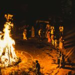 Captivating night scene of a traditional Indian fire ritual with people gathered around.