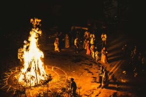 Captivating night scene of a traditional Indian fire ritual with people gathered around.